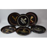 A Collection of Five Pressed Metal Guinness Drinks Trays