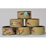 A Collection of Six Enamelled Oriental Napkin Rings