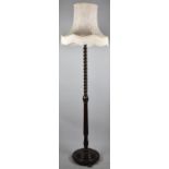 A Mid 20th Century Oak Barley Twist Standard Lamp with Shade