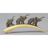 A Novelty Silver Brooch with Three Elephants in Line Having Trunks in Salute