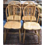 A Set of Four Mid 20th Century Wheel Back Dining Chairs
