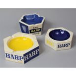 A Collection of Three Harp Lager Advertising Ashtrays