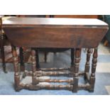 A 19th Century Oak Drop Leaf Gate Leg Oval Top Table, 93cm wide