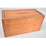 An Edwardian oak Rectangular Ballot Box with Carved Top and Emptying Door Under, 25cmsx12cmsx13cms