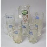 A Collection of Harp Lager Glasses and Pitcher