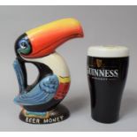 A Modern Heritage Toucan Money Box and a Novelty Money Box in the Form of a Glass of Guinness