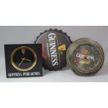 Two Reproduction Guinness Wall clocks and a Pressed Metal Beer Bottle Top Wall Plaque, 41cm Diameter