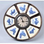 A Modern Circular Kitchen Clock with Eight Tile Segments Depicting Fish and Chickens, 22.5cm