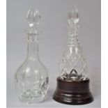 Two Cut Glass Decanters, One of Oval Bodied Form Housed in Turned Wooden Stand