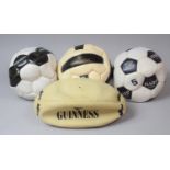 A Collection of Four Guinness and Harp Lager Rugby and Footballs