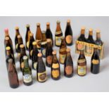 A Collection of Miniature Guinness and Harp Lager Beer Bottles