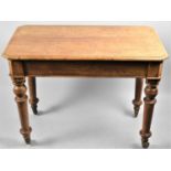 A Late 19th Century Oak Rectangular Side Table with Turned Supports and Casters, 90cm Long