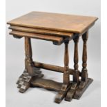 A Mid 20th Century Oak Nest of Three Tables with Turned Supports, The Largest 58cm wide