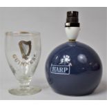 A Harp Lager Blue Glazed Globular Table Lamp and a Vintage Guinness Glass