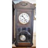 An Edwardian Mahogany Wall Clock with Westminster Chime Movement