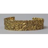 A Gold Plated Silver Bangle with Textured Finish, Stamped 925