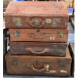 A Collection of Four Vintage Leather Suitcases