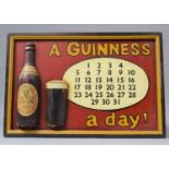 A Reproduction Rectangular Wooden Guinness Advertisement in the Form of a Calendar, "A Guinness a