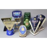 A Collection of Various Guinness and Harp Bar Beer Pumps and Signs