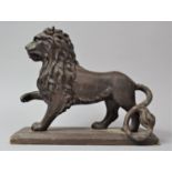 An 18th Century Style Cast Metal Study of a Lion with Paw Raised and Set on Wooden Plinth Base, Tail