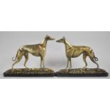 A Pair of Edwardian Brass Fireside Ornaments in the Form of Latto and Hidden Screw, Greyhounds