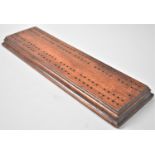A Late Victorian Mahogany Cribbage Board, 32cms Long and 10cms Wide