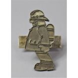 A Novelty Metal Badge by Mike Shearing, in the Form of a Fireman with Breathing Apparatus, Dated