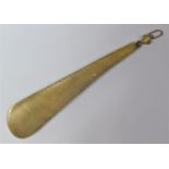 A 19th Century Brass Shoe Horn, 28cms Long