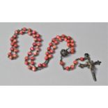A String of Dyed Mother of Pearl Beads with Crucifix Pendant
