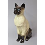 A Beswick Fireside Seated Persian Cat, 34.5cm high, Ear with Chip and Painted Black