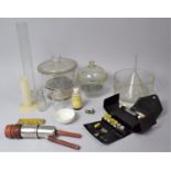 A Collection of Various Chemists Equipment to Include Measuring Flask, Funnels, Lidded Pots etc