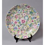 A 19th Century Chinese Charger Decorated with Hundred Flowers Motif In Multi Coloured Enamels,