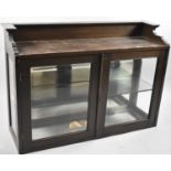 An Edwardian Glazed Oak Shop Counter Display Cabinet with Mirrored Back, Adjustable Mirrored Shelf