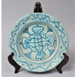 An 18th/19th Century Terracotta Ottoman Plate Decorated in Blue Enamels in the Iznik Style, 21cm