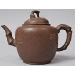 A 19th Century Chinese Yixing Teapot With Stylised Bamboo Spout and Handle Decorated in Relief