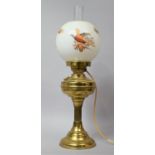 A Mid 20th Century Brass Table Lamp in the Form of an Oil Lamp with Opaque Glass Shade Decorated