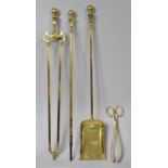 A Set of Three Polished Brass Long Handled Fire Irons and a Pair of Coal Tongs