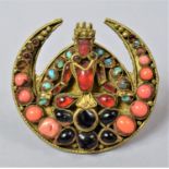 A Large Nepalese/Tibetan Circular Brooch Having Coral, Turquoise and Glass Mounts in the Form of