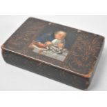 A 19th Century Lacquered Rectangular Snuff Box, the Hinged Lid Decorated with Gent Taking Supper,