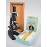 A Cased Children's Microscope by Hakings Together with a Box Set of Twelve Britex Specimen Slides,