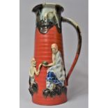 A Japanese Sumida Gawa Jug with Partial Drip Glaze and Applied Figural Decoration in Relief on Red