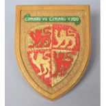 A Carved Wooden Commemorative Welsh Shield, 22cm high