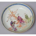 An 18th Century Porcelain Saucer Decorated with Applied Enamels in the Mandarin Pallette Depicting