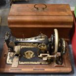 A Vintage Cased Frister and Rossmann Sewing Machine