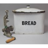 An Enamelled Bread Bin Containing Mincer