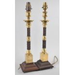 A Pair of Wooden and Brass Oriental Candle Sticks with Barley Twist Supports and Square Plinth