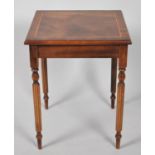 A Reproduction Mahogany Occasional Table with Crossbanded Top on Turned Tapering and Reeded