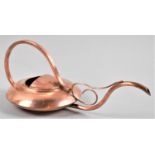 A Copper Novelty in the Form of a Compressed and Extended Watering Can with Looped Carrying