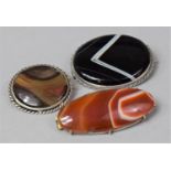 A Collection of Two Silver Banded Agate Brooches and One Other