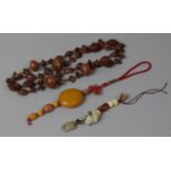 A Collection of Oriental Items to Include Olive Nut and Bead Necklace, Chinese Pendant with Amber